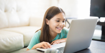 young girl learning at home