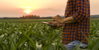 farmer using a tablet in a field