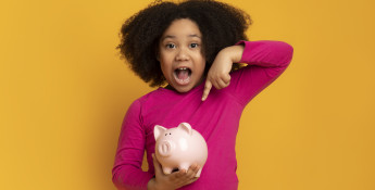 Girl With Piggy Bank