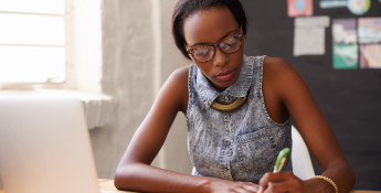 woman writing in a notebook