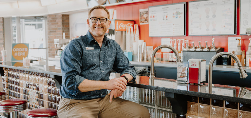 Tony Coast of Linger Gig Lab in Cimarron sits at the retro counter