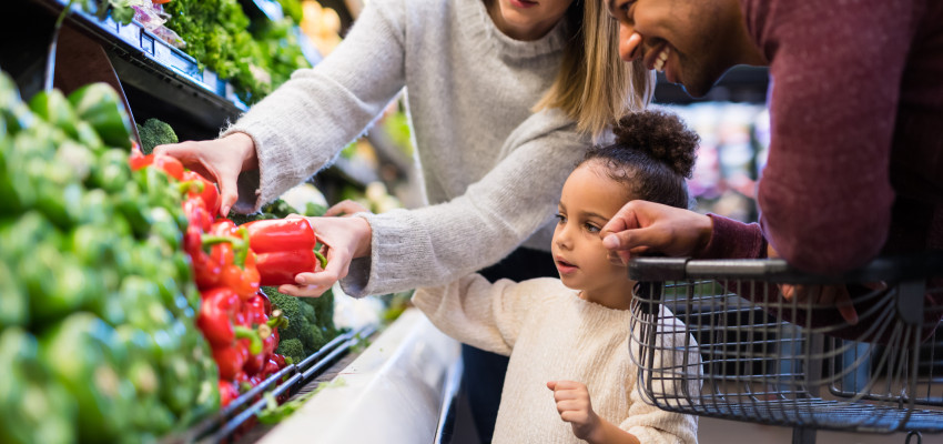 family buying vegetables