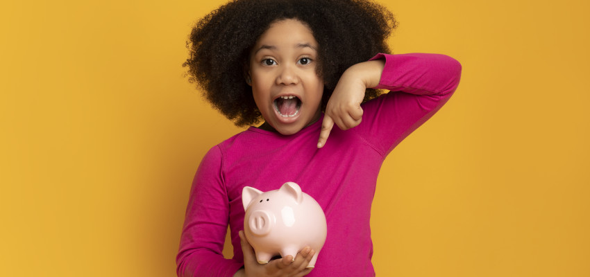 Girl With Piggy Bank