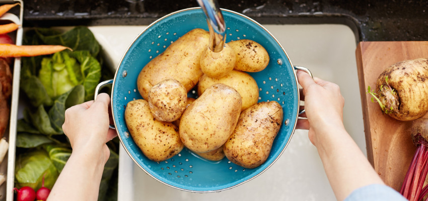 Woman Washing Potatoes