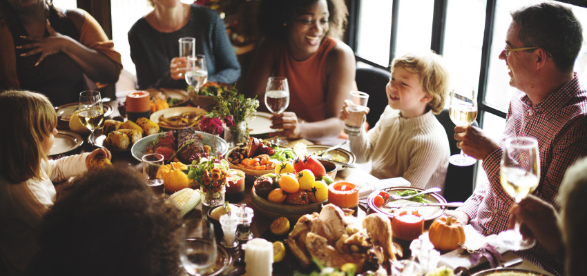 group enjoying Thanksgiving dinner