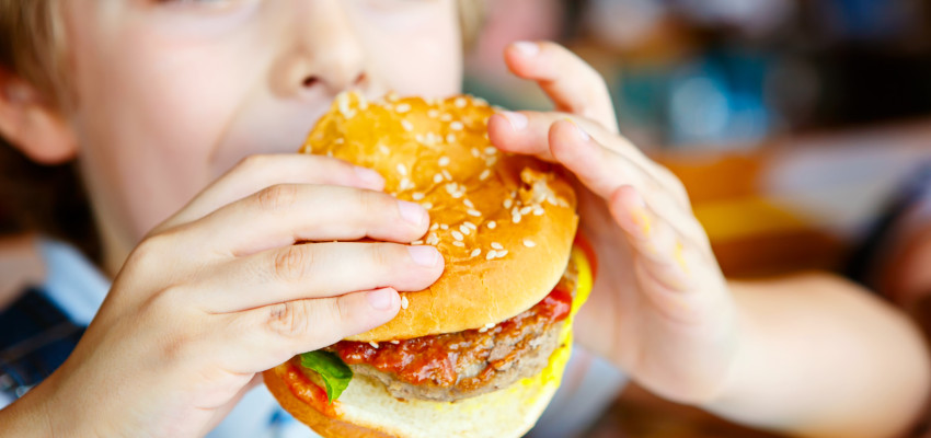 Kid Eating A Burger