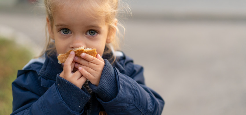 girl eating bread