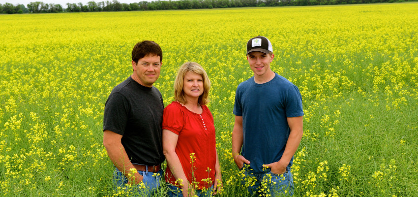 Peirce family in canola field Peirce family in canola field