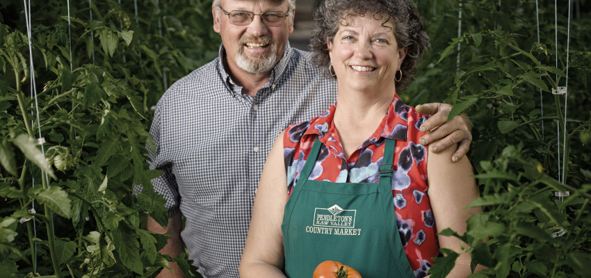 man and woman with tomatoes man and woman with tomatoes