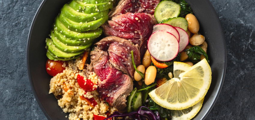 Buddha bowl with steak, quinoa and avocado