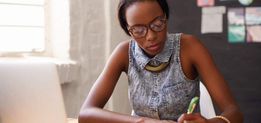 woman writing in a notebook