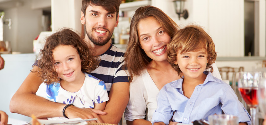 family at four eating breakfast