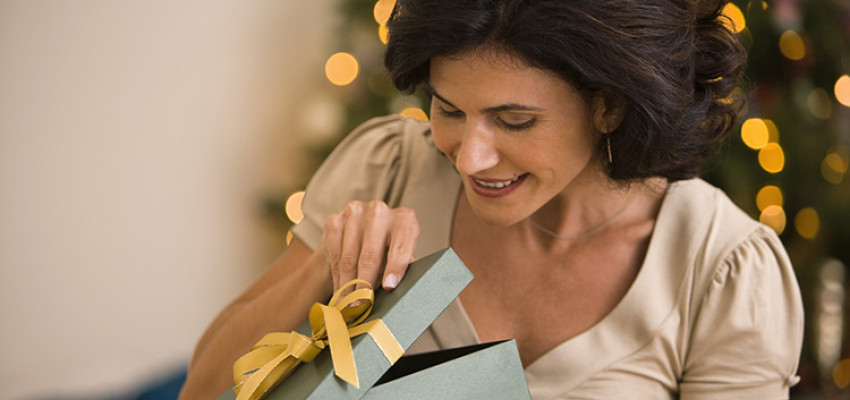 woman opening Christmas gift