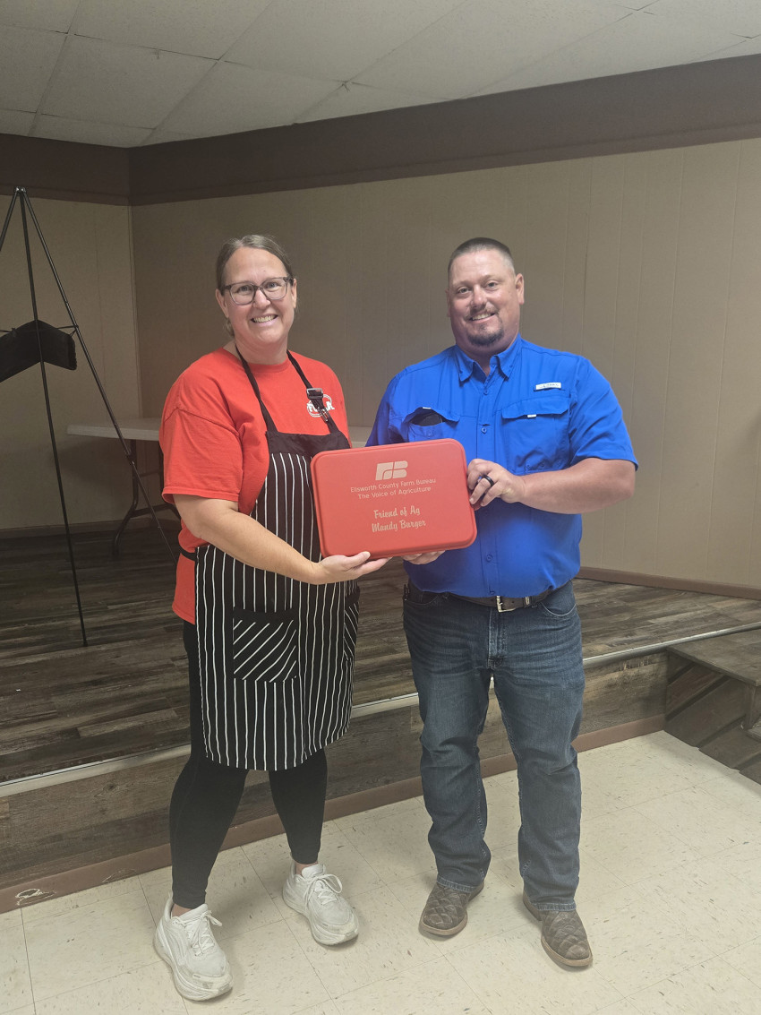 Mandy Burger of Ellsworth FCCLA receives the Friend of Agriculture Award from Ellsworth County Farm Bureau.