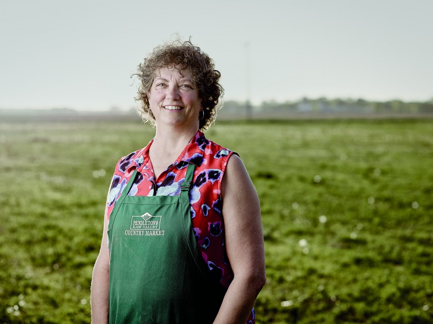 woman in front of field