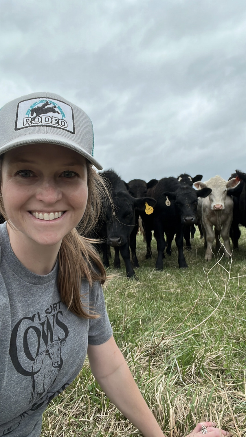 brandi with cattle in background