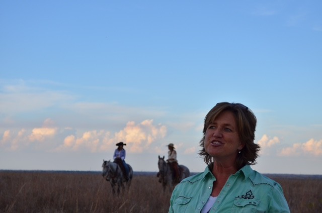 Kansas rancher in field with horses