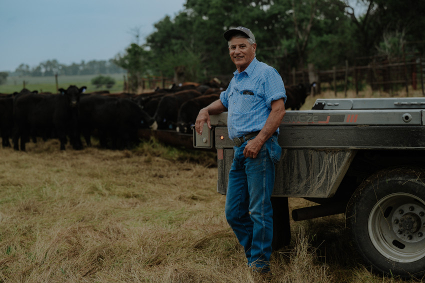 Joe Newland feeds cattle