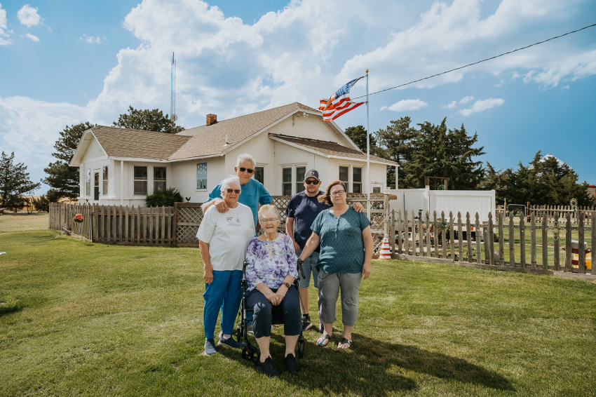 Zada and her husband, Robert Weilert; Janice Rewerts; and Gary and wife, Nina Wewer, stand at their Century Farm home in rural Wichita County.
