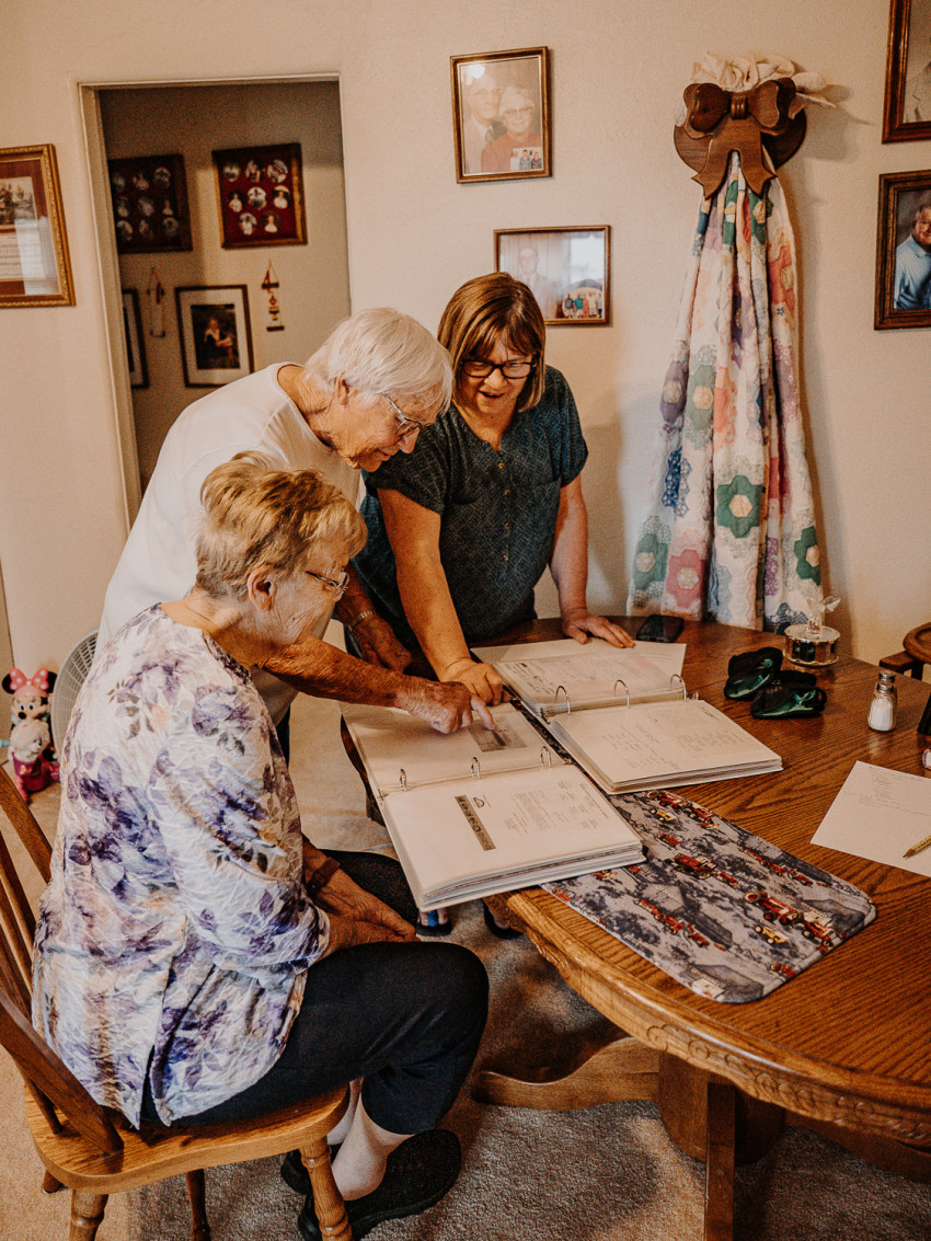 Minnie Mouse, in the center middle of the photo, looks over the sisters as they remember growing up on their Century Farm in Wichita County with their grandma, Minnie..