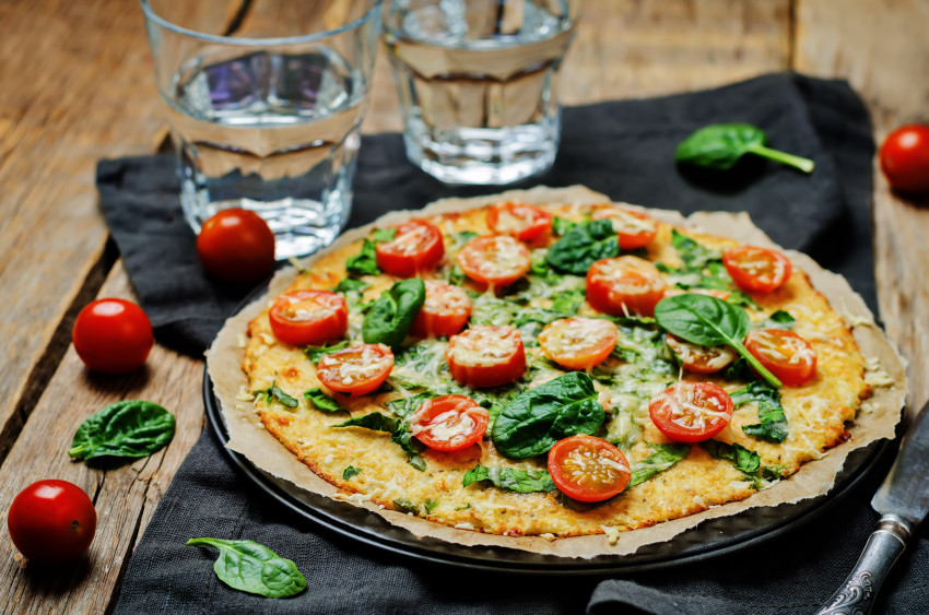 Adding spinach to pizza