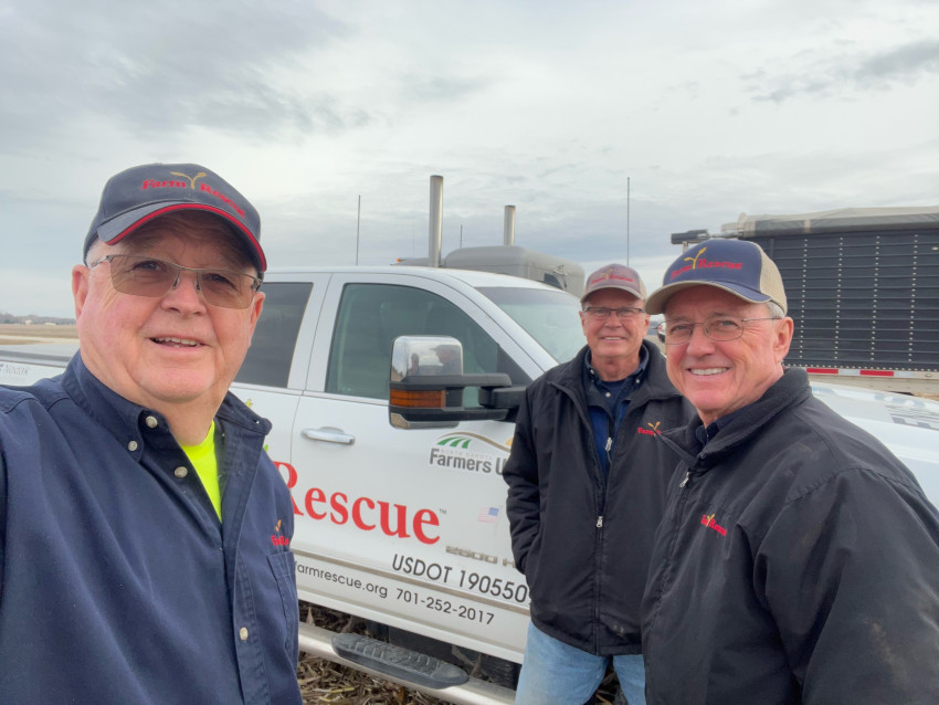 Glenn Biederman, second from the left, on a Farm Rescue case he volunteered for.