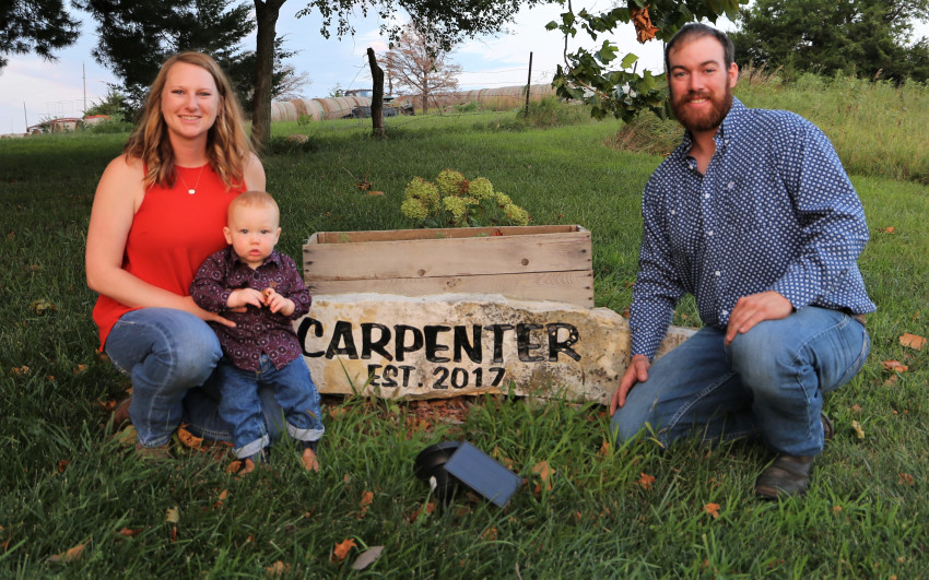 carpenter ranch family with family sign