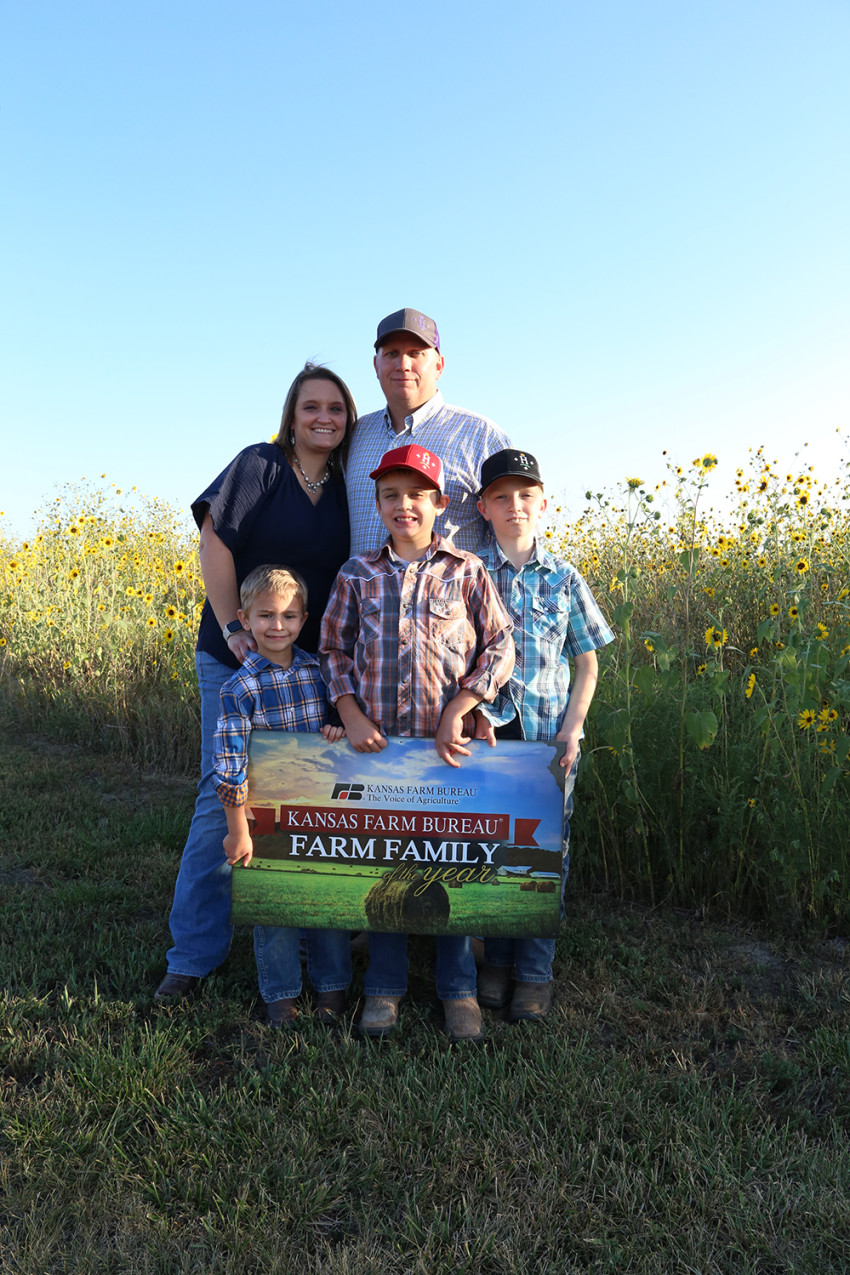 hornberger family with sign