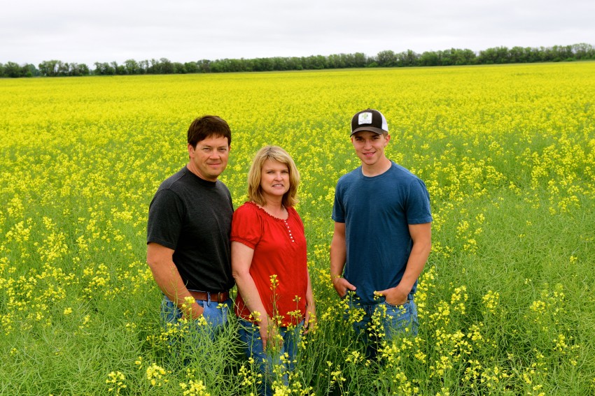 Peirce family in canola field