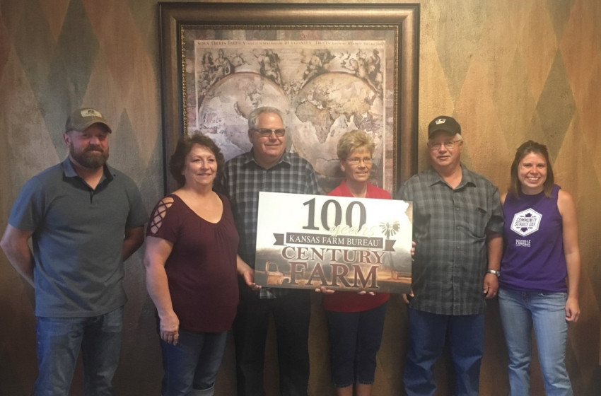 The Vogt farm’s first harvest was in 1919. Cody Woelk (Formerly with Greeley Co Farm Bureau), Sharon Vogt, Mike Vogt, Cindy Miller, Ron Miller and Simone Vogt pose with their Century Farm Award in 2019.