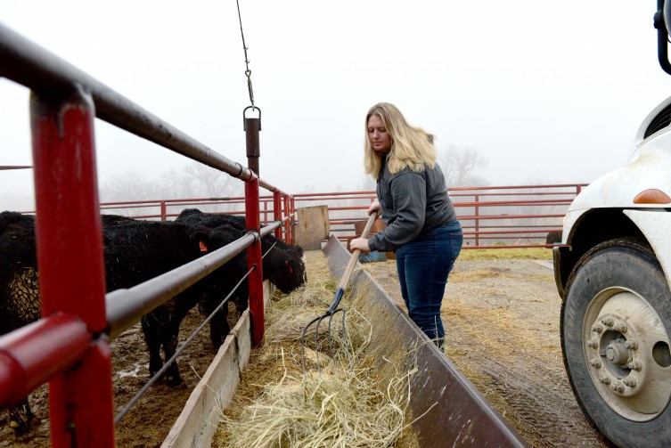 Jacquelyne Leffler feeds cattle