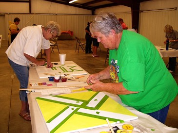 woman making barn quilt