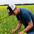 Connor Peirce in canola field