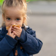 girl eating bread